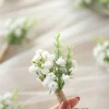 Boutonnieres for Guests in Baby's Breath