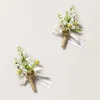Boutonnieres in May Lily & Olive