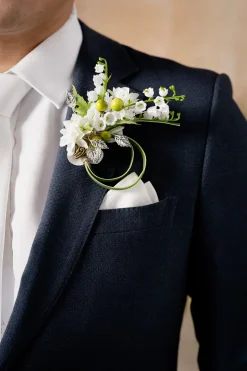Boutonnieres in May Lily & Olive