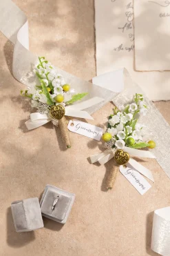 Boutonnieres in May Lily & Olive