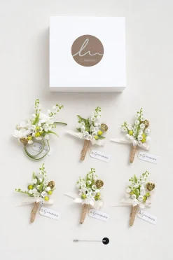 Boutonnieres in May Lily & Olive