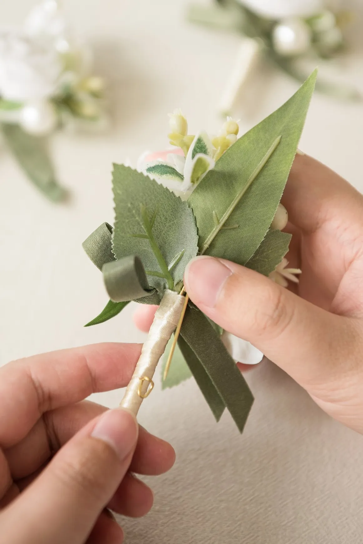 Boutonnieres in White & Sage
